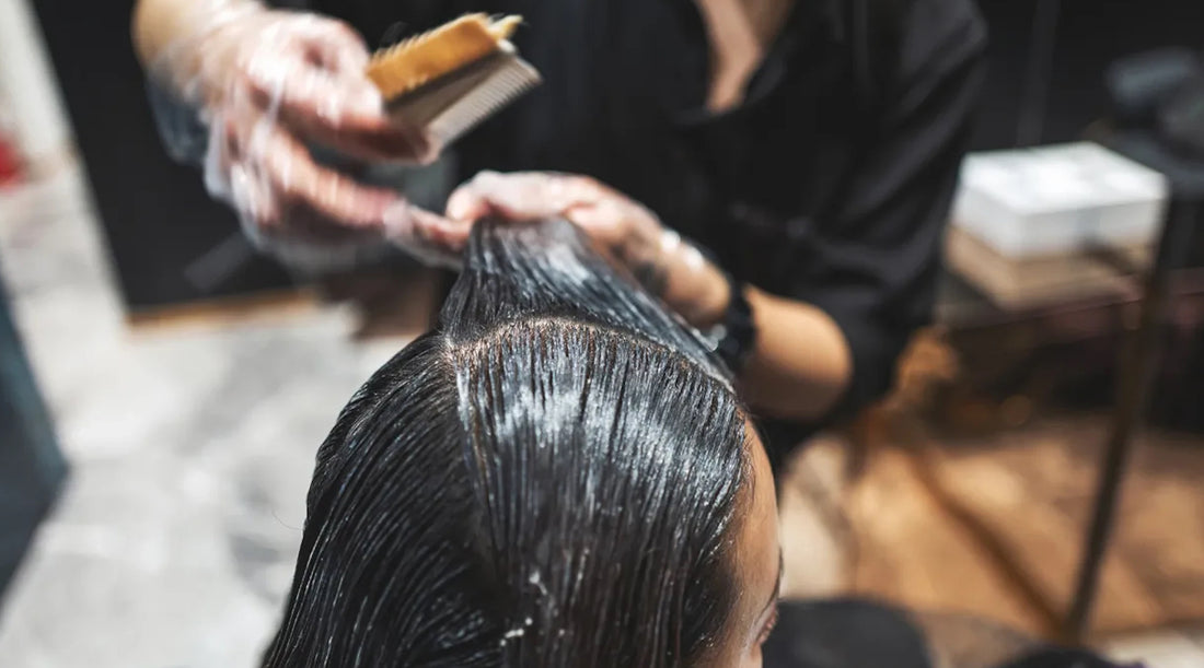 Keratin treatment/brazilian blow out performed at a salon by a hairdresser. Jun Xu - Getty Images 